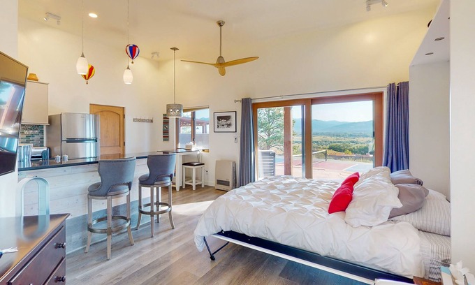 Taos Cabaña | Mountain-view casita with hot tub, pickeball court, walking labyrinth & orchard