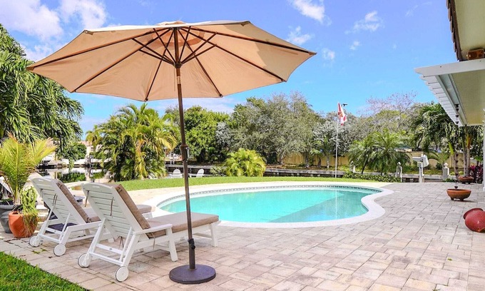 Cypress Lakes Casa | New! Amazing Waterfront Island Breezes - Heated Pool, Dock!