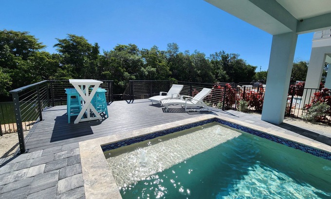 Cortez Casa | NEW! Saltwater Serenity .08 Miles to AMI, Canal Front w/Heated Pool!