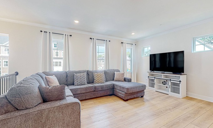 Ocean City Casa | Newly built row-end townhome with water view, pool access, patio, & balcony