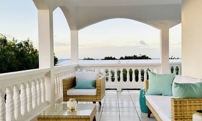 West End Village Casa | Newly Renovated Luxury West End Home Steps to Mead’s Bay and the Four Seasons.