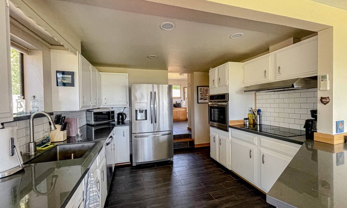 Austin Casa | Ocean view home with incredible setting & deck - walk to the beach, near town