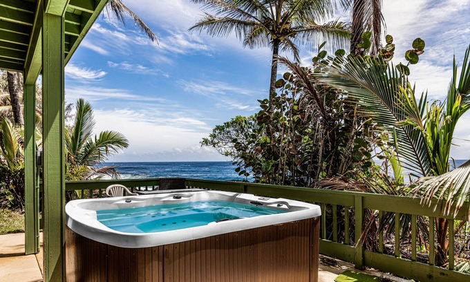 Keaau Casa | Oceanfront home with private hot tub, wraparound deck, ocean views, W/D & lanai