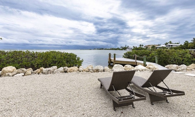 Breezeswept Beach Estates Casa | Oceanview Cottage: Embrace Island Living with Sandy Toes and Breathtaking Open Water Views!