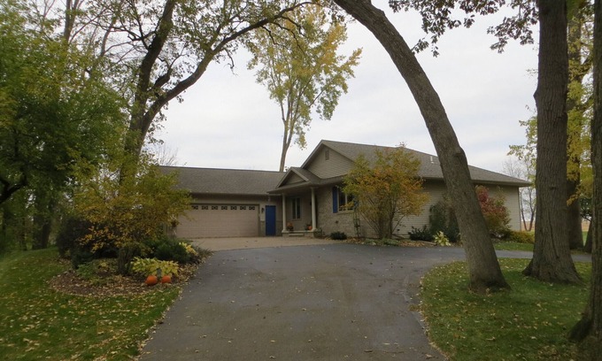 Pickett Casa | One bedroom and full bath in home 2 miles from EAA. Area with TV & refrigerator.