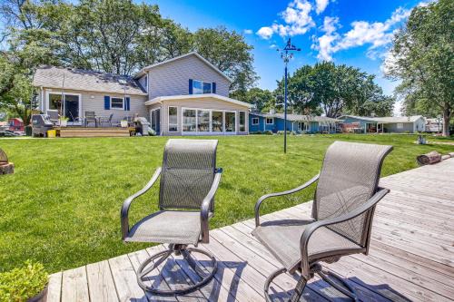 Oshkosh Casa | Oshkosh Canal-Front Home with Sunroom and Watercraft!