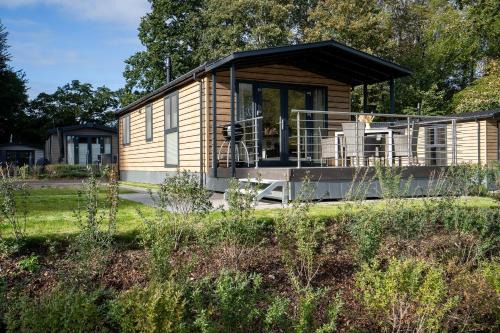 Gronenberg Casa | Ostseecamp Lübecker Bucht Haus "Morgensonne" mit überdachter Veranda