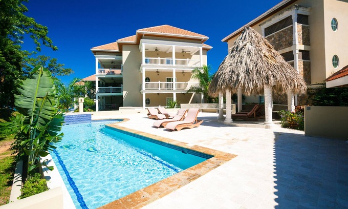Lawson Rock Condominio | Out our door onto the sand and into the water, luxury condo and Large Patio in Lawson