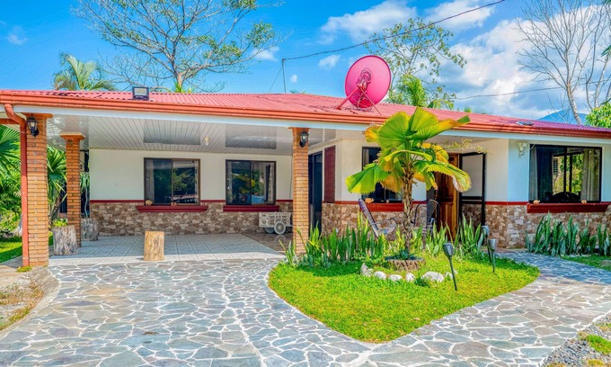 Garabito Casa | Palm-lined paradise with a pool, wood stove, & mountain views - dog-friendly