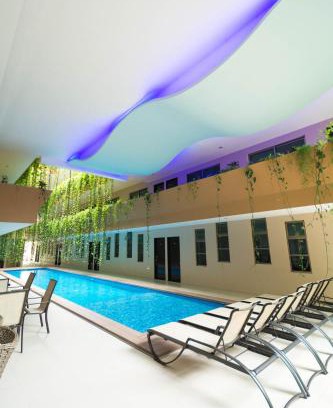 Centro Hotel | Palmarena Rooms & Residences - Long Stay Comfort with Parking, Sauna, Gym & Pool - Steps from 5th Avenue