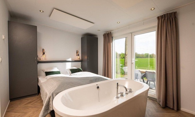 Municipality of Rijssen-Holten Chalet De Esquí | Panorama lodge with wellness and hottub | 2 p.