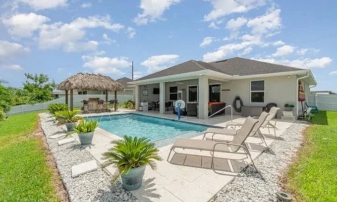 Trafalgar Casa | Paradise of Cape Coral on Canal, with Heated Pool, Tiki Hut Grill & Elec Bikes