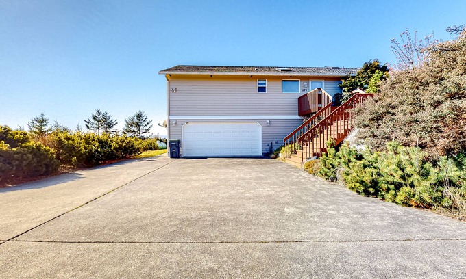Oak Harbor Casa | Peek-a-boo ocean view home with outdoor living space, W/D, and balcony