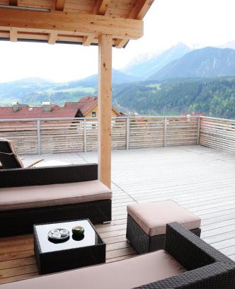 Haus im Ennstal Apartamento | Penthouse Alpine Living direkt an der Skipiste by Schladmingurlaub