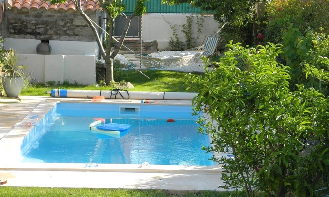 Saint-Genis Casa | Pretty village house with private heated pool. Opposite historic church.