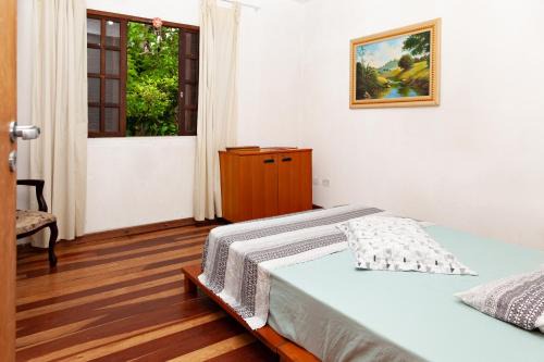 Pilarzinho Casa | quarto Refúgio no Bosque