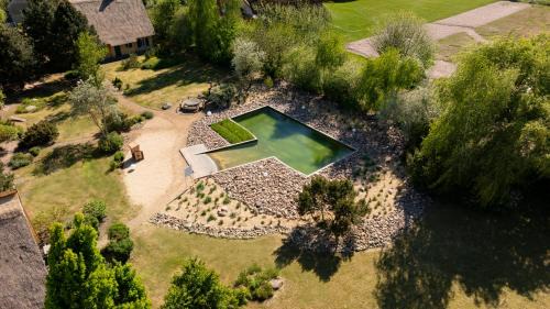 Krienke Casa | Reetdachhaus mit Schwimmteich in Krienke