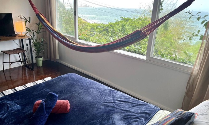 Vidigal Apartamento | Relax and watch the sunrise across the ocean from your hammock. Views of Ipanema across the water