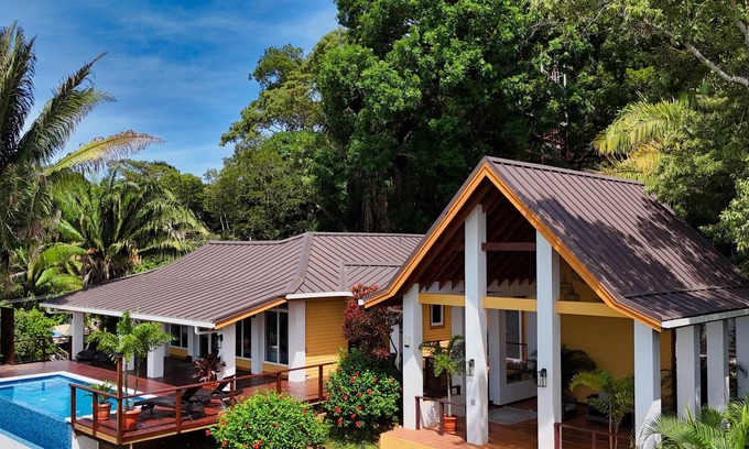 Gibson Bight Casa | Relax at this hillside retreat that overlooks the lush forest and the Caribbean.