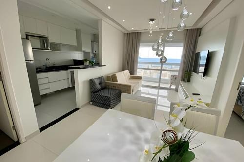 Gonzaga Apartamento | Requinte, vista mar, sauna e piscina!