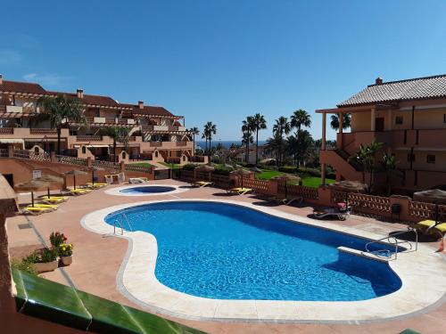 El Faro Apartamento | Resort Alta Loma, beach and pools