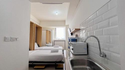 Makassar Apartamento | Restful Studio (No Kitchen) Apartment at Bandaraya - Tallasa City Makassar By Travelio