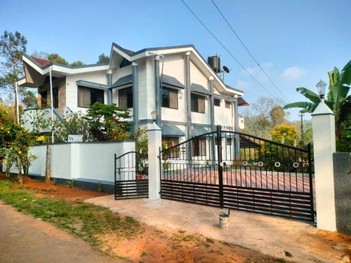 Madikeri Casa | River view white villa
