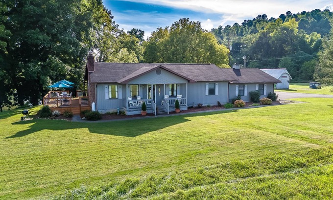 Elizabethton Casa | Riverfront home with dock, mountain view, grill, firepit, smart TVs