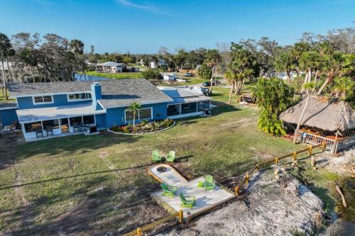 Braden River Casa | Riverside Oasis Home w Tiki Hut & Firepit