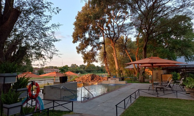 Maun Cabaña | Riverside Splash- Stylish and Cozy Cottages by the River bank