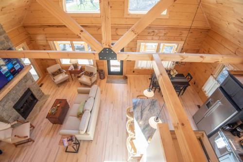 Warrensville Casa | Riverstead Cabin- Riverfront, Wrap Around Porch, Hot Tub & More