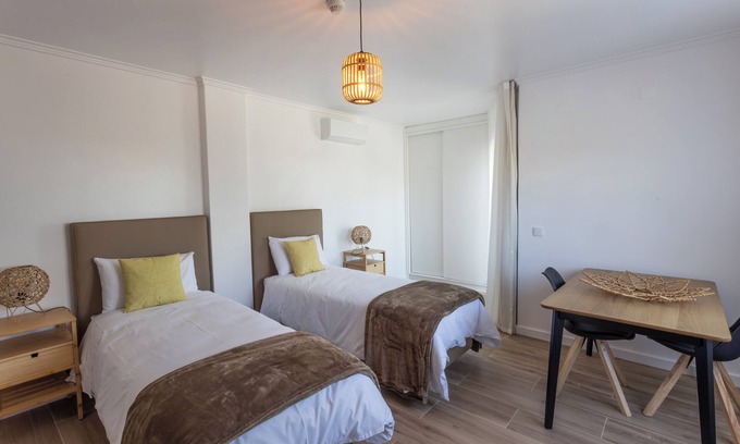 Castelo Apartamento | Room with private bathroom and balcony with pool view at Casa das Vinhas in Sesimbra