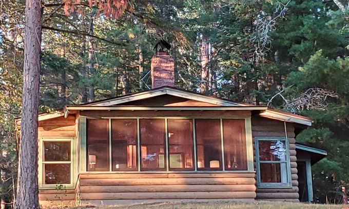 Bigfork Cabina | Rustic cabin in remote wooded area on point overlooking lake.