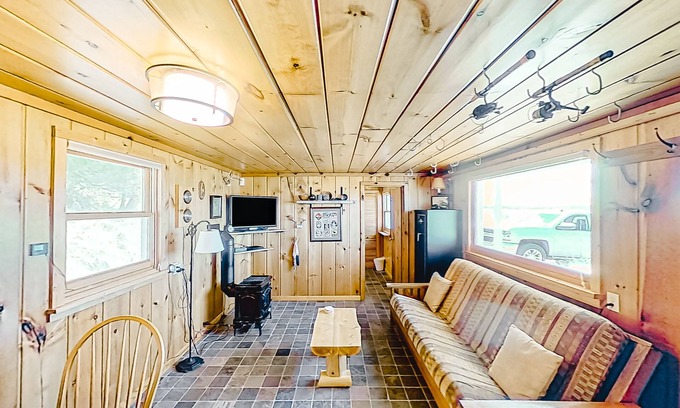 Lake Township Casa | Rustic getaway on Crystal Lake w/ firepit, guest house & private dock