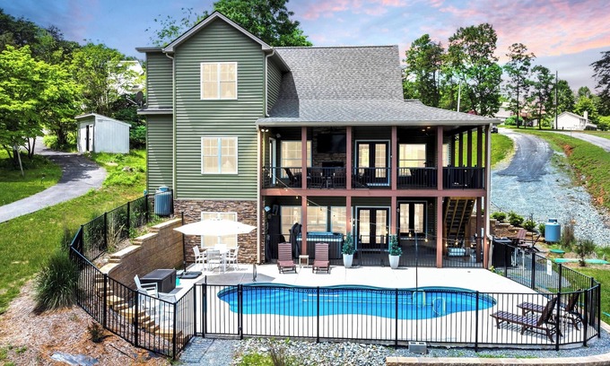 Moneta Casa | Sandy Bottom Cove, New Lakefront Luxury w/ Covered Decks + Heated Salt Pool, Beach, Hot Tub, Dock!