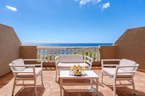 Arico Apartamento | Seaside Apartment with Spacious Terrace, Pool, and Wi-Fi