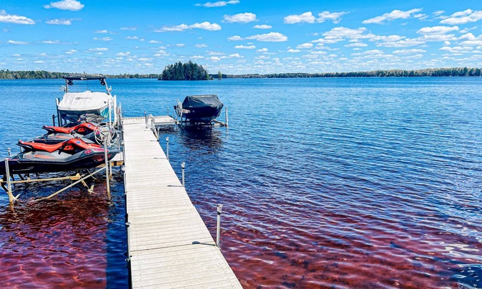 Three Lakes Casa | Serene lakefront retreat with wet bar, wraparound decks, dock, fireplaces, AC