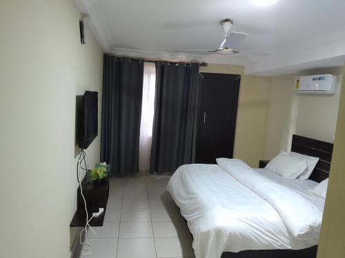 Madina Apartamento | Serene Royal Residence