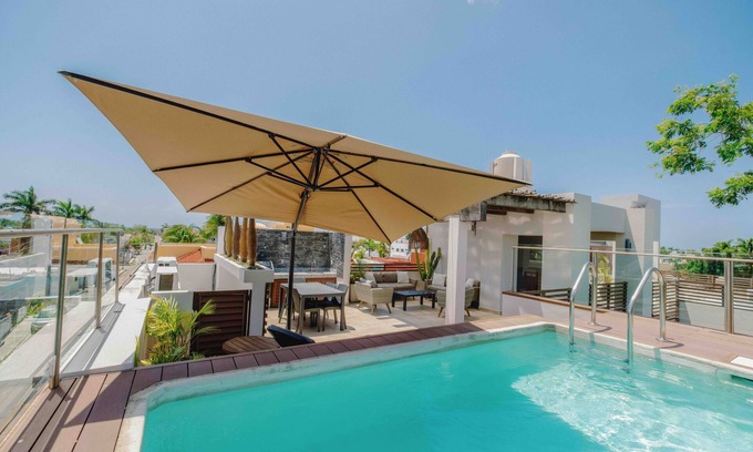 Colonos Cuzamil Apartamento | Serviced 1-Bedroom Apartment · Rooftop BBQ + Pool · Bikes · Security