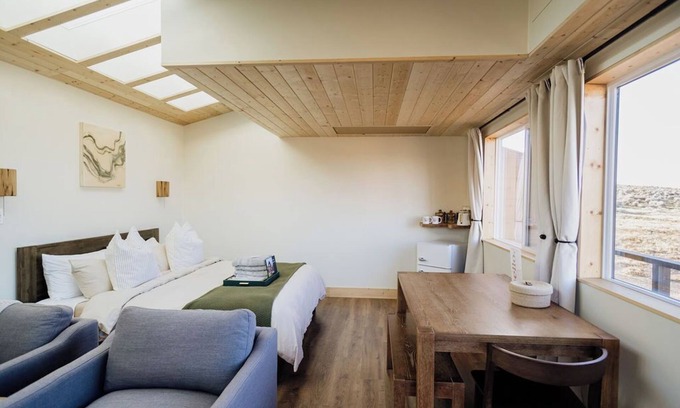 Monticello Alquiler De RV | Solar Powered Casita with 2 beds and a comfy seating area overlooking a peaceful desert setting
