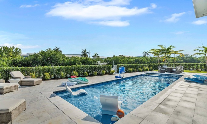 Coury Casa | Sophisticated 5-bedroom, elevator, 50' dock, heated pool/spa, sleep 12