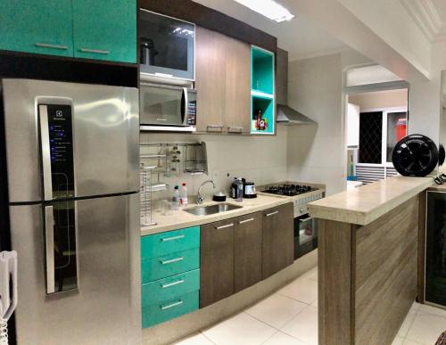 Indaia Apartamento | Spazio Felicita, Indaia, Bertioga, apartamento pé na areia