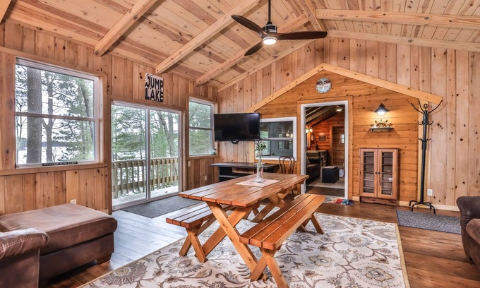 Three Lakes Casa | Splendid lakefront home with deck, private W/D, fireplace, and patio area