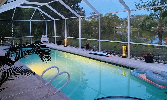 Palm Coast Casa | Stunning Lake house,heated pool, pet friendly,close to beach, restaurants ,bars