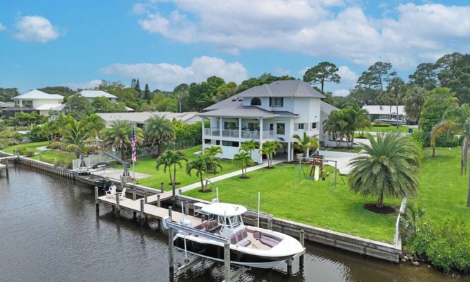 Palm City Casa | Stunning Water Front River House with Gourmet Kitchen & Large Boat Dock!