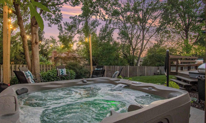 West Omaha Casa | Central Family Oasis, with Hot Tub & Fenced Yard!