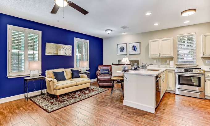 American Beach Condominio | Stylish & sun-filled retreat with large patio & fireplace - near beaches & golf