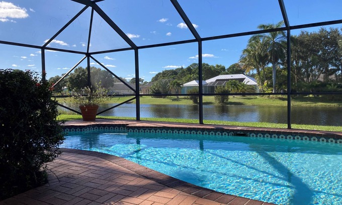 Port Saint Lucie Casa | Stylish Waterfront Home w/Heated Pool, 8 miles to the Beach, Close to Shopping.