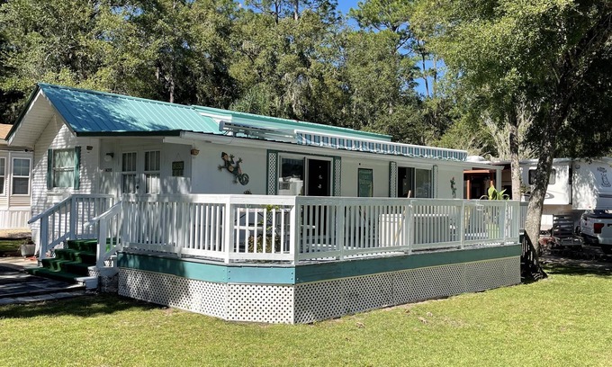 Fort McCoy Cabaña | Super roomy Park Model in premier resort with lake, pools, dock and boat launch.