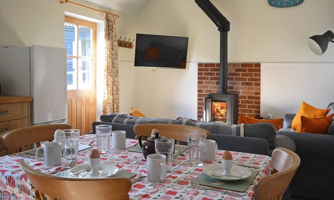 Nunney Casa | The Old Parlour - timber clad cosy converted cow shed